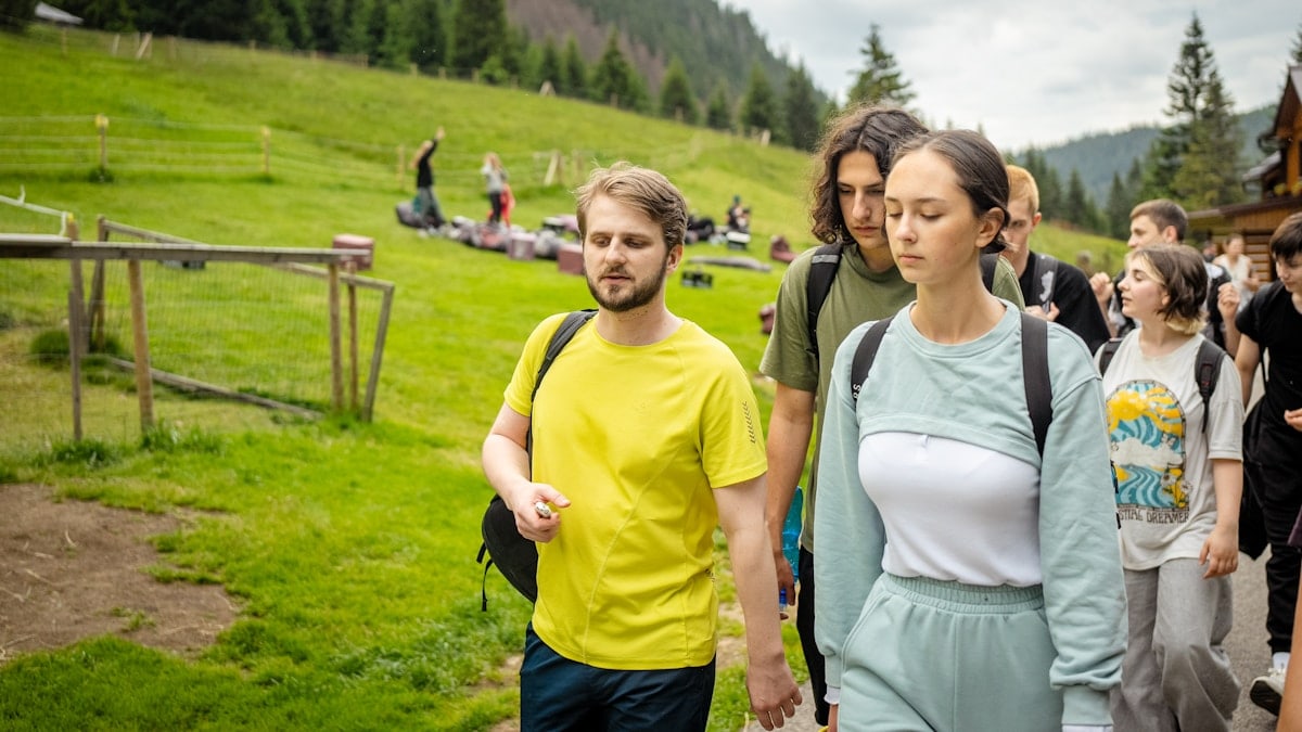 Group of people hiking on a mountain trail